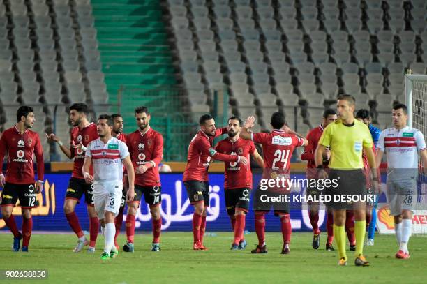 Egypts al-Ahly player Abdallah el-Saeed celebrates with his teammates after scoring a goal during the Egyptian Premier League football match between...
