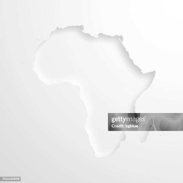 africa map with embossed paper effect on blank background - relief carving stock illustrations