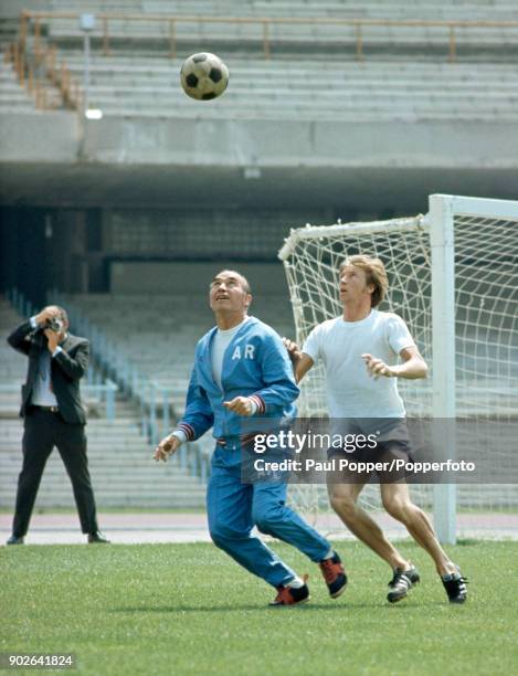 England manager Sir Alf Ramsey is shadowed by Manchester City's Colin Bell as the reigning World Champions prepare for their first match at the 1970...