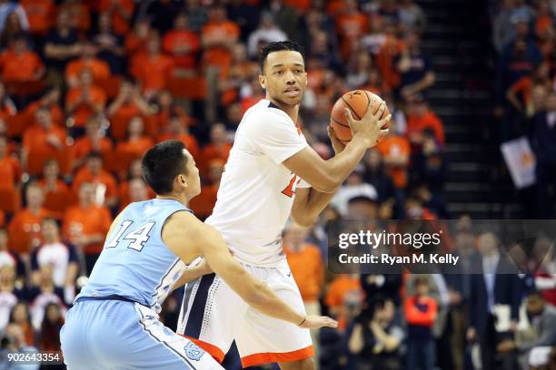 January 6: Marco Anthony of the Virginia Cavaliers sets up a play in front of Kane Ma of the North Carolina Tar Heels in the second half during a...