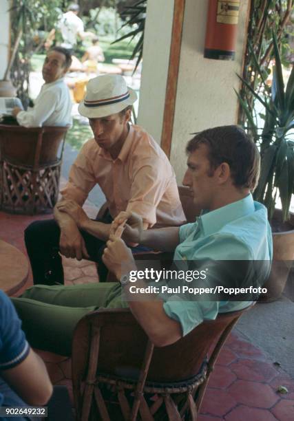 England footballers Alex Stepney and Jack Charlton playing cards at the Hilton Hotel in Guadalajara during the 1970 FIFA World Cup in Mexico, 30th...