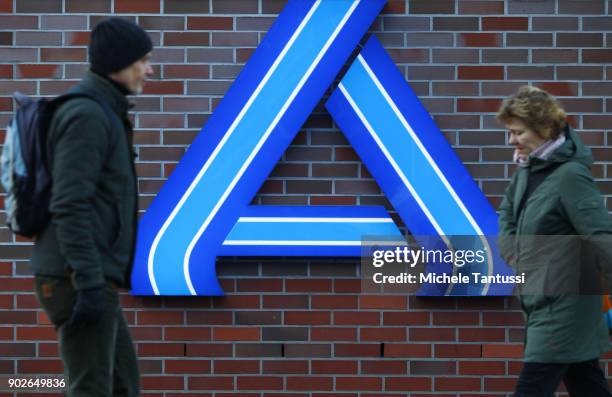 Pedestrians Pass by an ALDI Discount supermarket on January 8, 2018 in Berlin, Germany. According to government statisticians, nominal revenue grew...