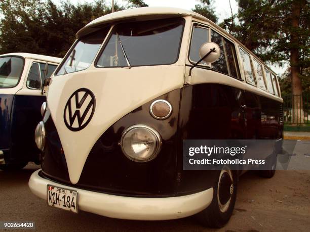 Angle view of a brown and white Volkswagen split T1 15 windows Brazilian Kombi.