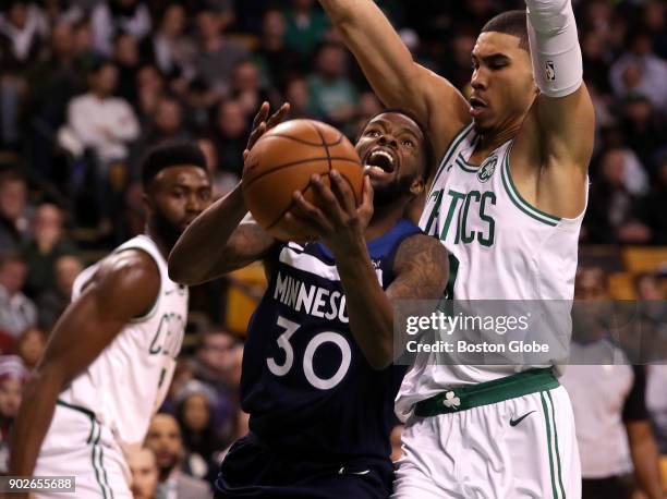 Boston Celtics forward Jayson Tatum defends Minnesota Timberwolves guard Aaron Brooks during the third quarter. The Boston Celtics host the Minnesota...