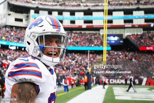 Jordan Poyer the Buffalo Bills reacts after scoring a touchdown after an interception during the second quarter of a game against the New England...