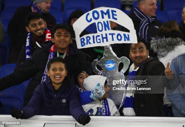 Brghton fans hold a tin foil FA Cup prior to The Emirates FA Cup Third Round match between Brighton & Hove Albion and Crystal Palace at Amex Stadium...