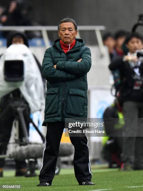 Head coach Yuichiro Honda of Ryutsu Keizai University Kashiwa looks on during the 96th All Japan High School Soccer Tournament final match between...