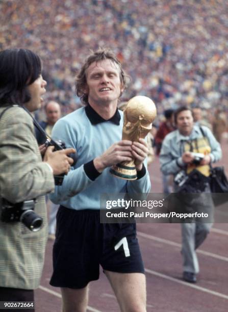 West Germany goalkeeper Sepp Maier carrying the trophy after the FIFA World Cup Final between West Germany and Holland at the Olympic Stadium in...