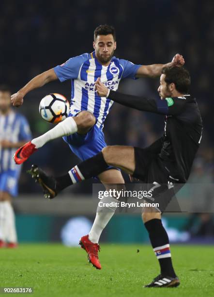 Sam Baldock of Brighton and Hove Albion and Yohan Cabaye of Crystal Palace battle for the ball during The Emirates FA Cup Third Round match between...