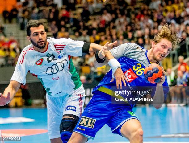 Hungary's Iman Jamali and Sweden's Jesper Nielsen vie during a friendly handball game between Sweden and Hungary at Partille Arena, Partille, Sweden...