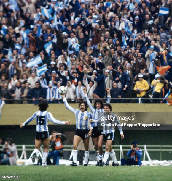 Mario Kempes has scored Argentina's 2nd goal, and celebrates with Leopoldo Luque and Daniel Bertoni as Jorge Olguin runs to join them, during the...