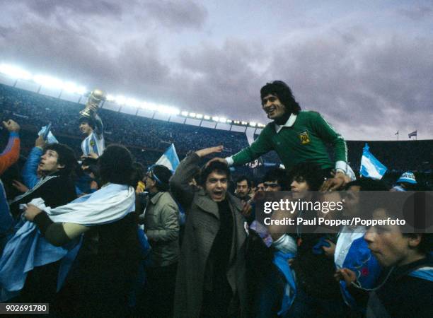 Argentina fans poured onto the pitch after the match and carried their heroes on a lap of honour following the FIFA World Cup Final between Argentina...