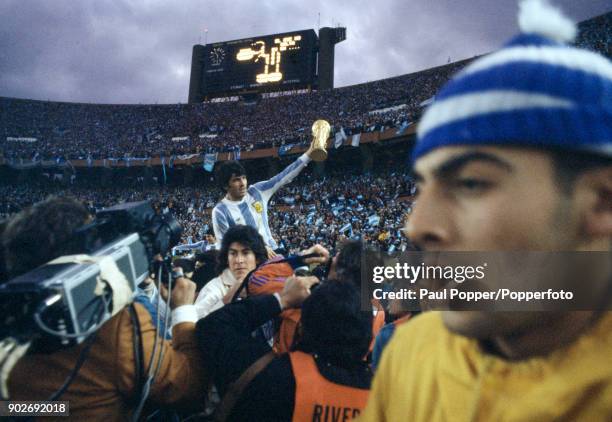 Argentina fans poured onto the pitch after the match and carried their heroes on a lap of honour following the FIFA World Cup Final between Argentina...