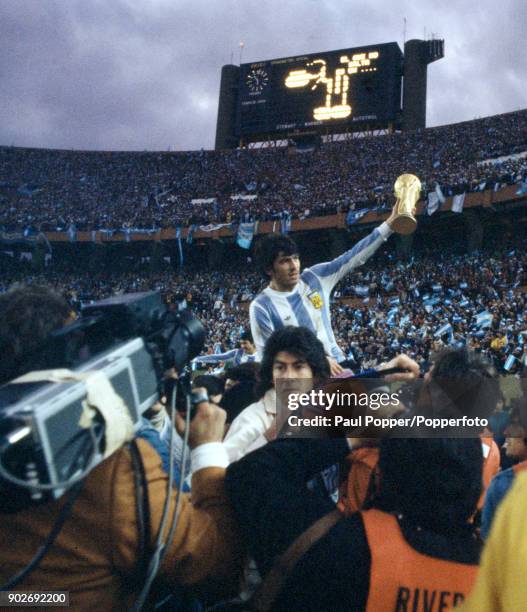 Argentina fans poured onto the pitch after the match and carried their heroes on a lap of honour following the FIFA World Cup Final between Argentina...