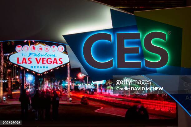 Signage is seen on the eve of CES in Las Vegas, Nevada on January 8, 2018. / AFP PHOTO / DAVID MCNEW
