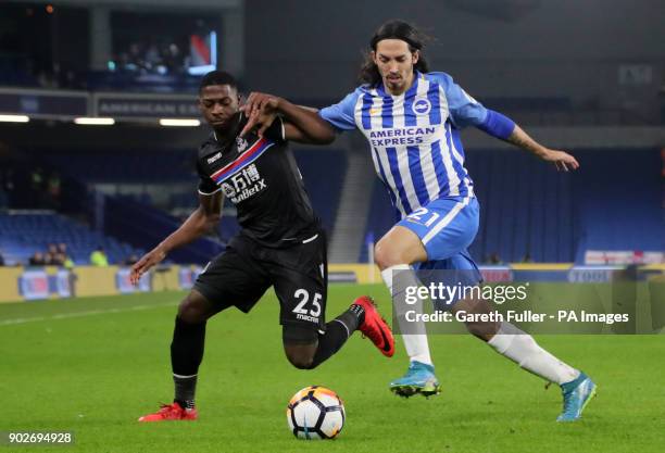 Crystal Palace's Sullay Kaikai and Brighton & Hove Albion's Ezequiel Schelotto battle for the ball during the Emirates FA Cup, Third Round match at...