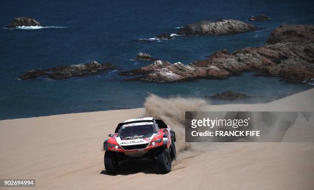 Sheikh Khalid Shiekh Al Qassimi of United Arab Emirates and his co-driver Xavier Panseri of France steer their Peugeot during Stage 3 of the Dakar...