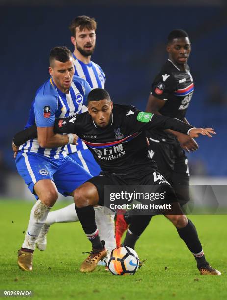Jairo Riedewald of Crystal Palace tangles with Tomer Hemed of Brighton and Hove Albion during The Emirates FA Cup Third Round match between Brighton...