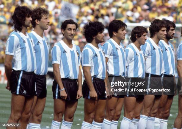 The Argentina team line up for the National Anthems prior to the FIFA World Cup match between Argentina and Brazil at the Estadio Sarria in...