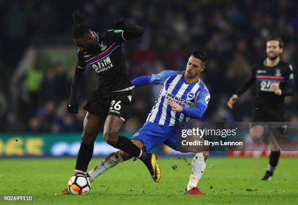 Bakary Sako of Crystal Palace battles with Biram Kayal of Brighton and Hove Albion during The Emirates FA Cup Third Round match between Brighton &...