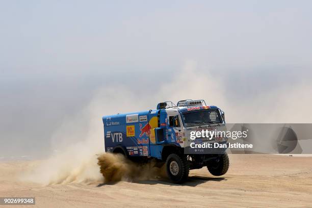Airat Mardeev of Russia and Team KAMAZ Master drives with co-driver Aydar Belyaev of Russia and mechanic Dmitriy Svistunov of Russia in a 4326 Kamaz...