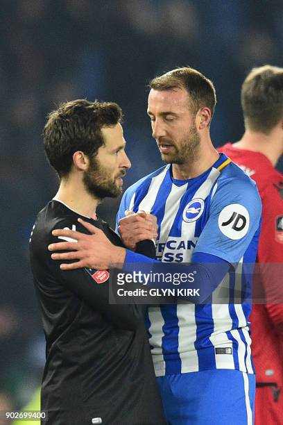 Crystal Palace's French midfielder Yohan Cabaye talks to Brighton's English striker Glenn Murray after the English FA Cup third round football match...