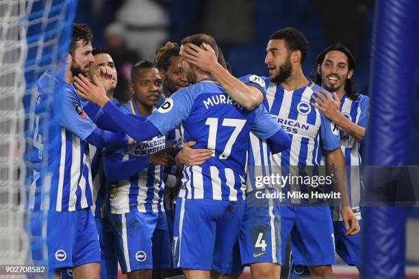 Team mates surround Glenn Murray of Brighton after his winner during The Emirates FA Cup Third Round match between Brighton & Hove Albion and Crystal...