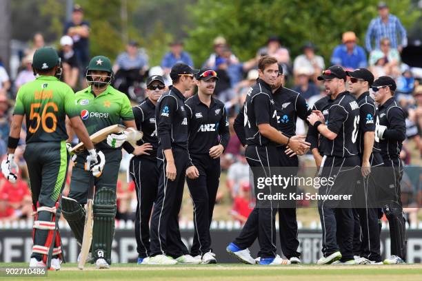 Tim Southee of New Zealand is congratulated by team mates after dismissing Azhar Ali of Pakistan during the second match in the One Day International...