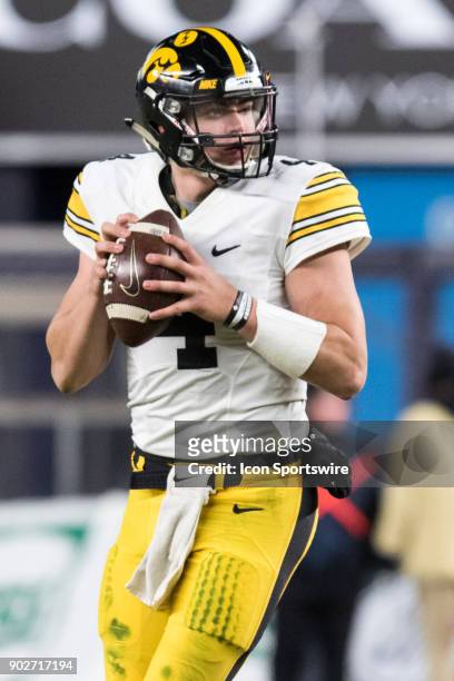 Iowa Hawkeyes Quarterback Nate Stanley back in the pocket during the third quarter of the New Era Pinstripe Bowl featuring the University of Iowa...