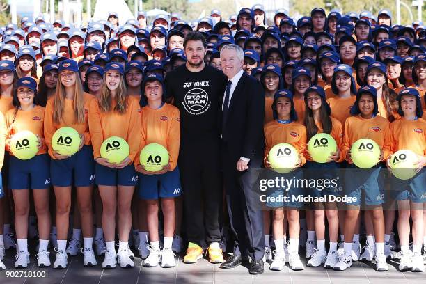 Stan Wawrinka of Switzerland and tournament director Craig Tiley officially welcomes the Australian ball kids during a practice session ahead of the...