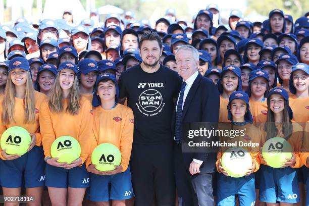 Stan Wawrinka of Switzerland and tournament director Craig Tiley officially welcomes the Australian ball kids during a practice session ahead of the...