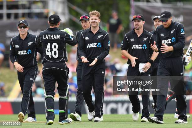 Lockie Ferguson of New Zealand is congratulated by team mates after dismissing Babar Azam of Pakistan during the second match in the One Day...
