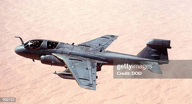 Tactical Electronic Warfare Squadron 130 EA-6B Prowler aircraft passes over the Saudi desert during Operation Desert Shield. VAQ-130 is based aboard...