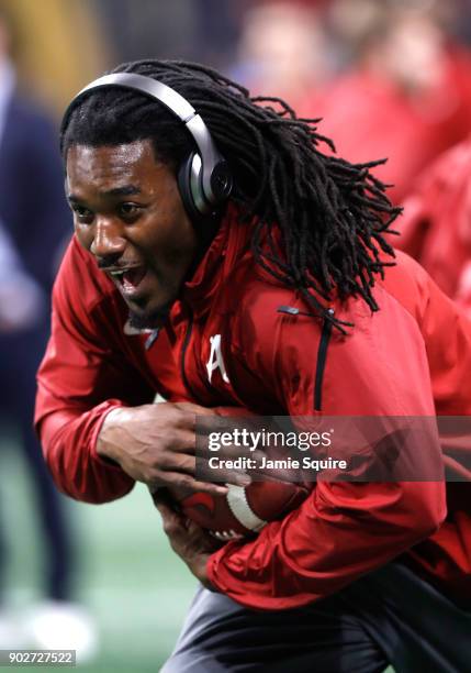 Bo Scarbrough of the Alabama Crimson Tide warms up prior to the CFP National Championship presented by AT&T against the Alabama Crimson Tide at...