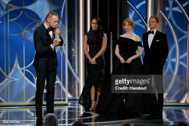 In this handout photo provided by NBCUniversal, Alexander Skarsgård accepts the award for Best Performance by an Actor in a Supporting Role in a...