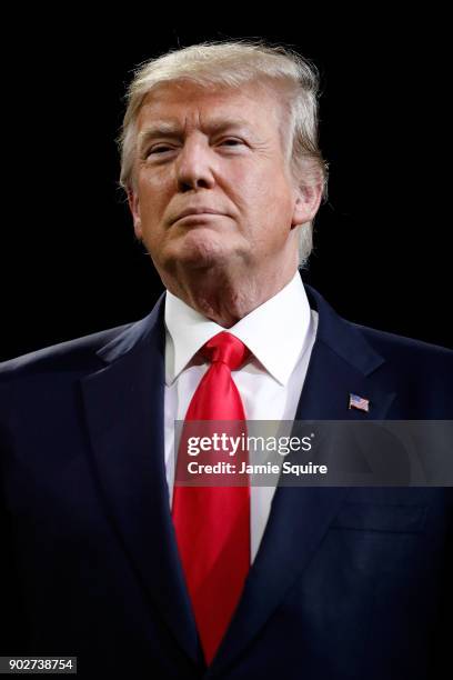 President Donald Trump on field during the national anthem prior to the CFP National Championship presented by AT&T between the Georgia Bulldogs and...