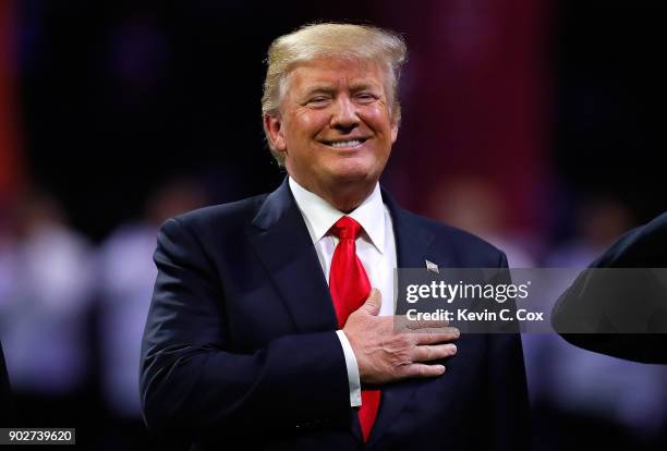 President Donald Trump on field during the national anthem prior to the CFP National Championship presented by AT&T between the Georgia Bulldogs and...