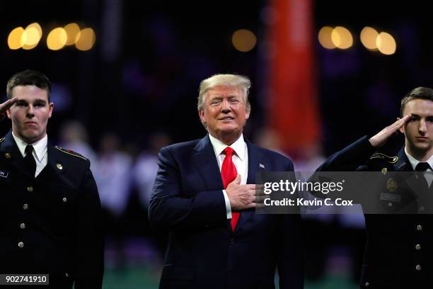 President Donald Trump on field during the national anthem prior to the CFP National Championship presented by AT&T between the Georgia Bulldogs and...
