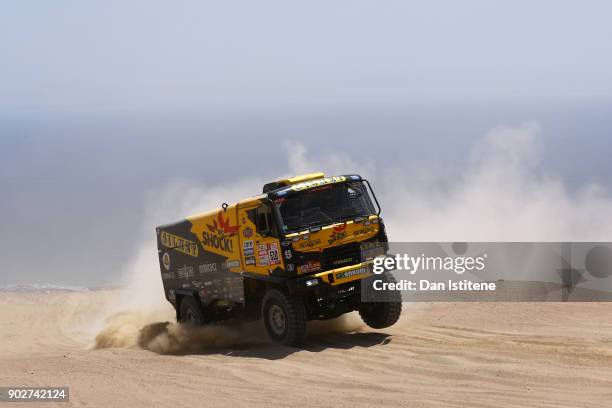Martin Macik of the Czech Republic and Big Shock Racing drives with co-driver Frantisek Tomasek of the Czech Republic and mechanic Michal Mrkva of...