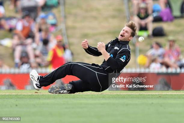 Lockie Ferguson of New Zealand fields the ball off his own bowling during the second match in the One Day International series between New Zealand...