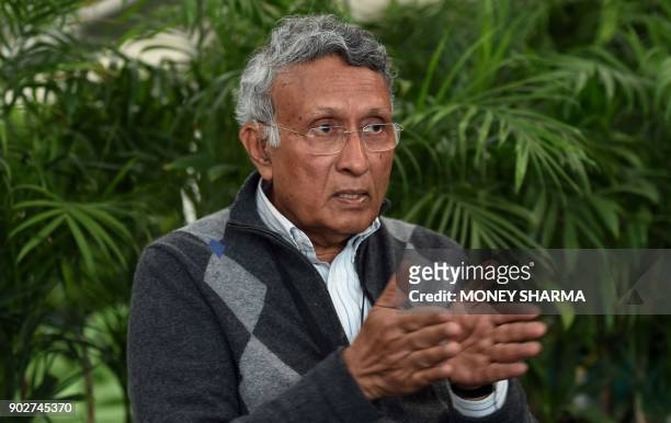 In this photograph taken on December 27 Indian environmentalist Kamal Meattle speaks during an interview with AFP in the greenhouse at his office in...