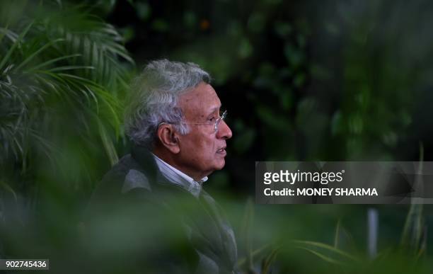 In this photograph taken on December 27 Indian environmentalist Kamal Meattle speaks during an interview with AFP in the greenhouse at his office in...