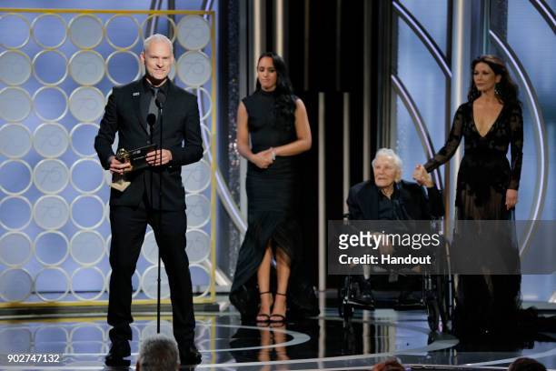 In this handout photo provided by NBCUniversal, Martin McDonagh accepts the award for Best Screenplay – Motion Picture for “Three Billboards Outside...