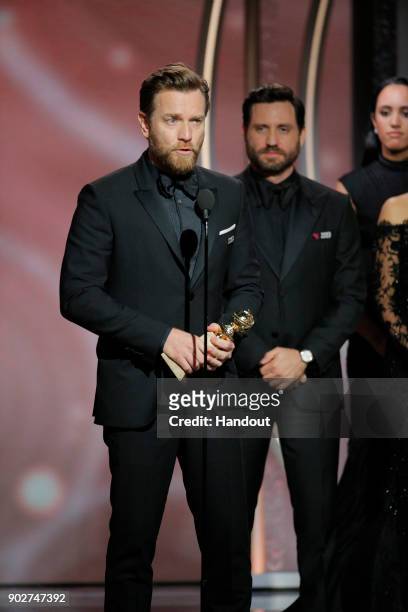 In this handout photo provided by NBCUniversal, Ewan McGregor accepts the award for Best Performance by an Actor in a Limited Series or Motion...