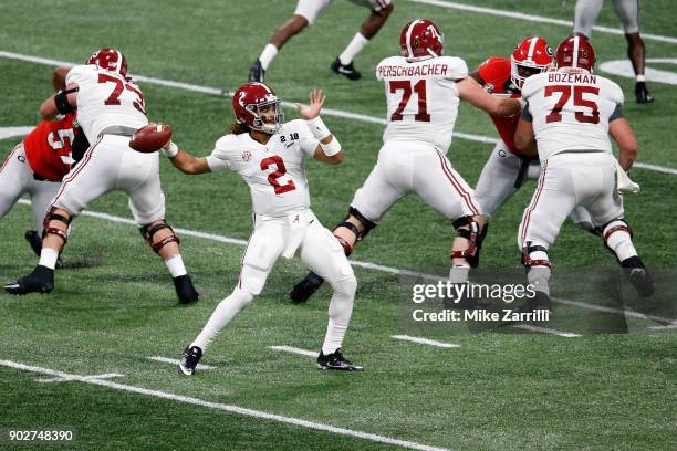 Jalen Hurts of the Alabama Crimson Tide throws a pass during the first quarter against the Georgia Bulldogs in the CFP National Championship...