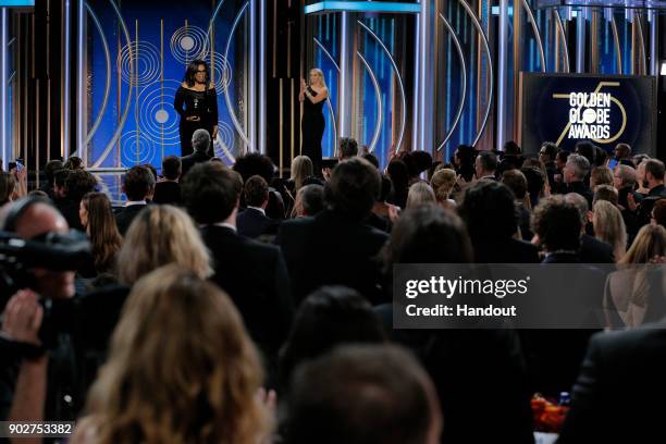 In this handout photo provided by NBCUniversal, Oprah Winfrey accepts the 2018 Cecil B. DeMille Award during the 75th Annual Golden Globe Awards at...