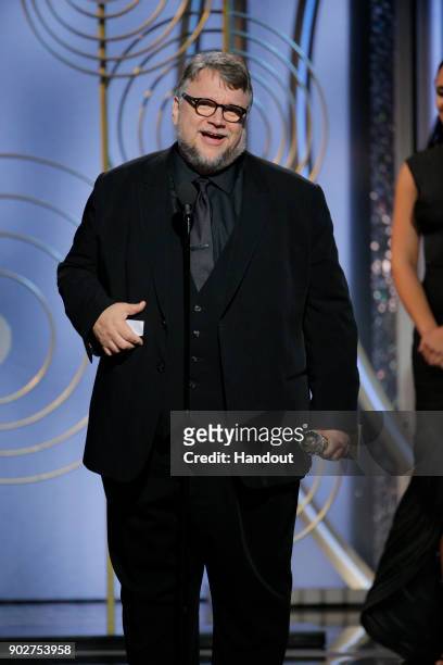 In this handout photo provided by NBCUniversal, Guillermo del Toro accepts the award for Best Director – Motion Picture for “The Shape of Water”...