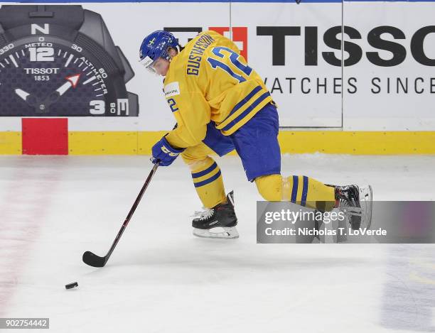 Glenn Gustafsson of Sweden skates the puck up ice against Canada during the second period of play in the IIHF World Junior Championships Gold Medal...