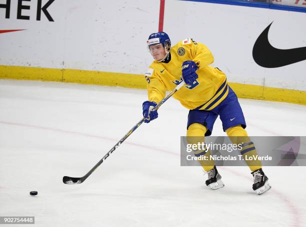 Gustav Lindström of Sweden passes the puck against Canada during the second period of play in the IIHF World Junior Championships Gold Medal game at...