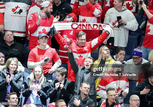 Team Canada fans celebrate the go ahead goal with 1:14 remaining in the third period of play in the IIHF World Junior Championships Gold Medal game...